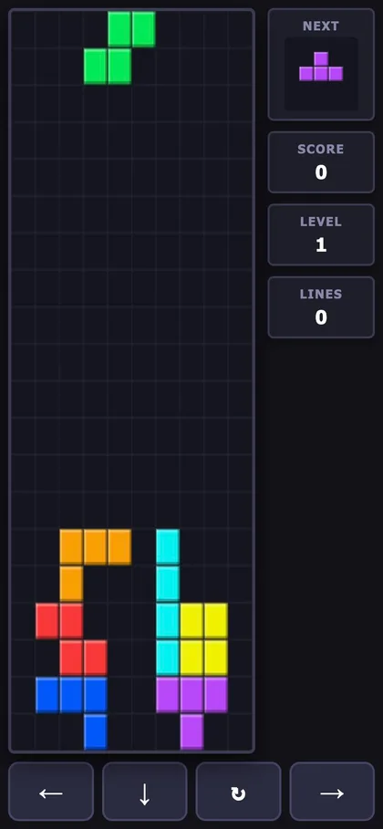 スマホ幅の落ちものパズル。下に左・下・回転・右の操作ボタンが並んでいる